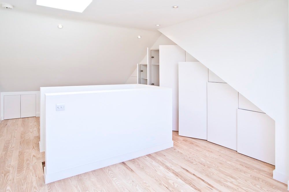 Loft room with built-in storage under the eaves