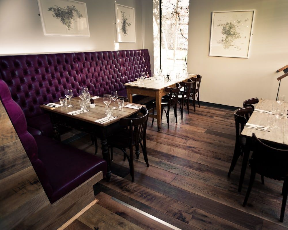 Restaurant fit-out with banquette seating and reclaimed oak floor